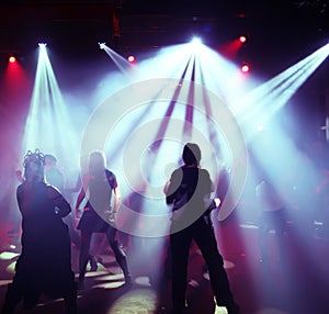 Silhouettes of a dancing teenagers