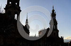 Silhouettes of Dresden Cathedral of Trinity Hofkirche and Dresden Castle Hausmannsturm. Dresden, Germany. November 2019