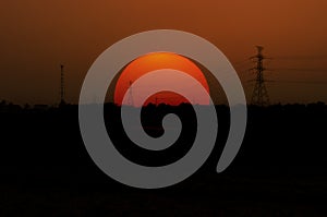 Silhouettes electricity pole