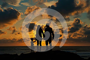 Silhouettes of a family on a trip, bonding under sunset