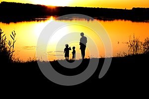 Silhouettes of the father and sons