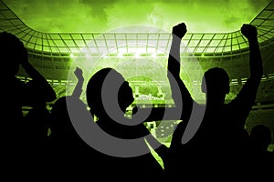 Silhouettes of football supporters