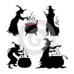 Silhouettes of Halloween Witches Cooking Using a Cauldron