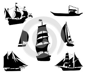 Silhouettes of historic sailing ships photo