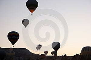 Silhouettes of hot air balloons on sky background.