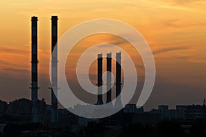 Silhouettes of the  industrial chimneys