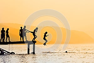 Silhouettes of kids jumping