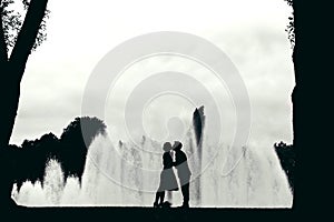 Silhouettes of kissing people