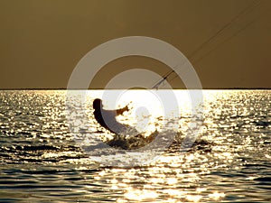 Silhouettes kitesurf on a gulf