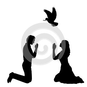 Silhouettes of man and woman pray for peace. I