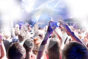 Silhouettes of massive crowd at party concert club music happy