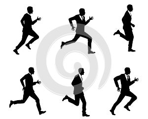 Silhouettes of men running