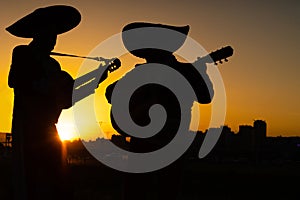 Silhouettes of a mexican musicians mariachi