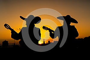 Silhouettes of a mexican musicians mariachi