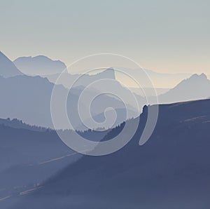 Silhouettes of Mount Wiriehore and other mountains in the Bernese Oberland. View from Mount Niesen direction southwest.