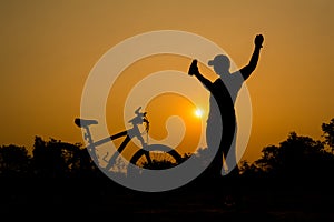 Silhouettes of mountain bike with man