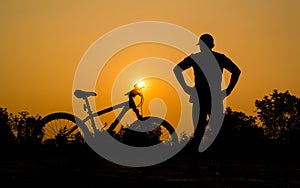 Silhouettes of mountain bike with man