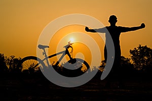 Silhouettes of mountain bike with man