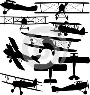 Silhouettes of old aeroplane - biplane photo