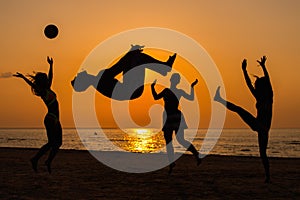 Silhouettes of a people having fun on a beach