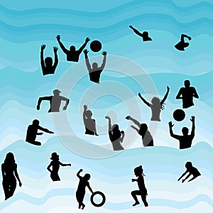 Silhouettes of people having fun in the water