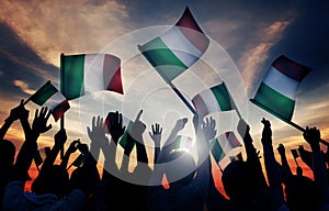 Silhouettes of People Holding Flag of Italy