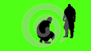 silhouettes of people physical confrontation on green screen