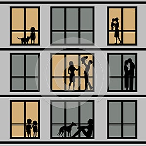 Silhouettes of people in windows