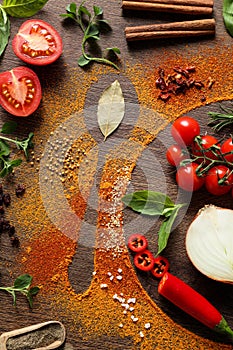 Silhouettes of plate with spoon made of spices and different ingredients on wooden table, flat lay