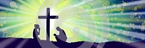Silhouettes of praying woman and man under the cross in green color
