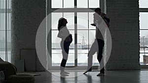 Silhouettes of Pregnant Woman, Husband and Son