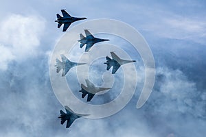 Silhouettes of russian fighter aircrafts SU-27 in the sky