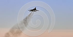 Silhouettes of Russian Su-27 fighters in the sky.