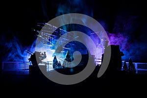 Silhouettes of satellite dishes or radio antennas against night sky. Space observatory