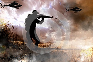 Silhouettes of soldier and helicopters in combat zone. Military photo