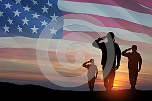 Silhouettes of soldiers saluting on background of USA flag. Greeting card for Veterans Day, Memorial Day.