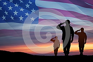 Silhouettes of soldiers saluting on background of USA flag. Greeting card for Veterans Day, Memorial Day.