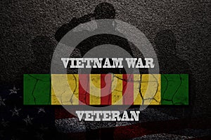Silhouettes of soldiers saluting and vietnam Campaign Ribbon with text Vietnam War Veteran.