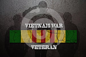 Silhouettes of soldiers saluting and Vietnam Campaign Ribbon with Vietnam War Veteran inscription.