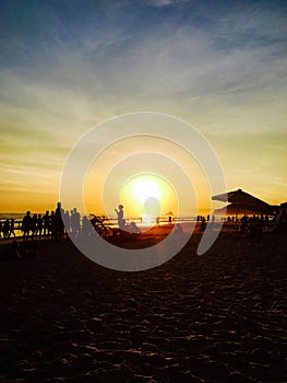 Silhouettes in the sunset by the Atlantic Ocean