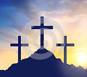 Silhouettes of three crosses on calvary hill