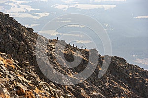 Silhouettes of tourists on the Krywan ridge. High Tatra Mountain