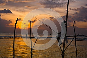Silhouettes of the traditional Sri Lankan stilt fishermen