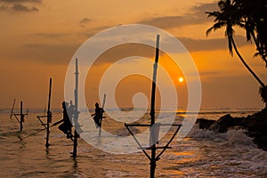 Silhouettes of the traditional Sri Lankan stilt fishermen