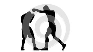 Silhouettes of two boxers sparring in a studio