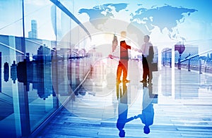 Silhouettes of Two Businessman Shaking Hands