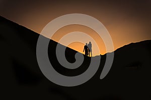 Silhouettes of two people