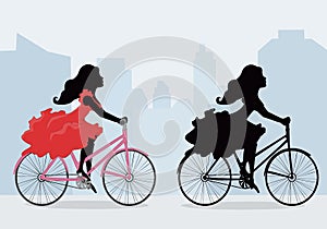 Silhouettes of women on the bike