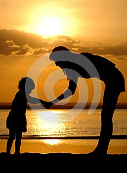 Silhouettes of the women and child