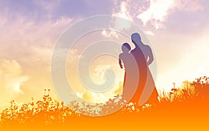 Silhouettes of a women with her kid